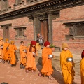 Young Buddhist monks walking in morning alms at Bhaktapur